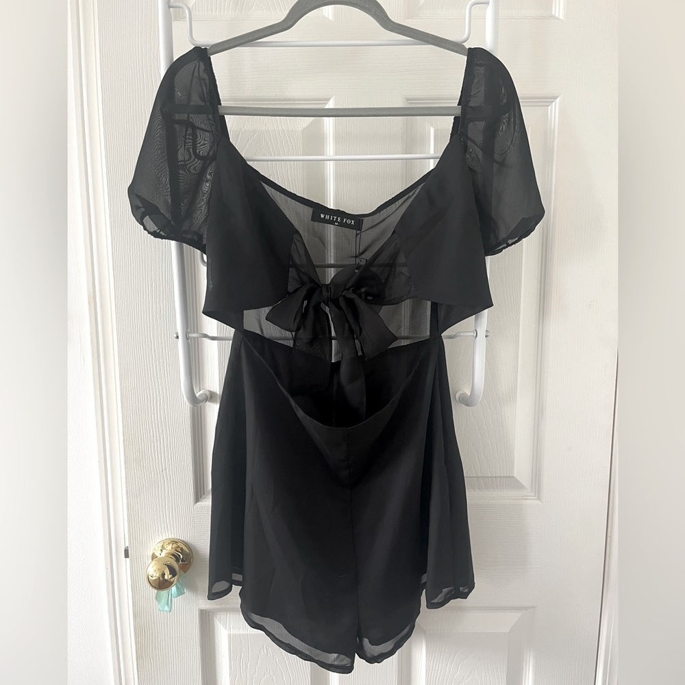 White Fox black one piece with tie at the front and built in shorts